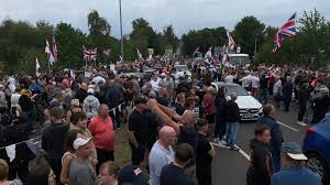 Large crowd gathers in the UK to protest housing of asylum seekers in local hotels